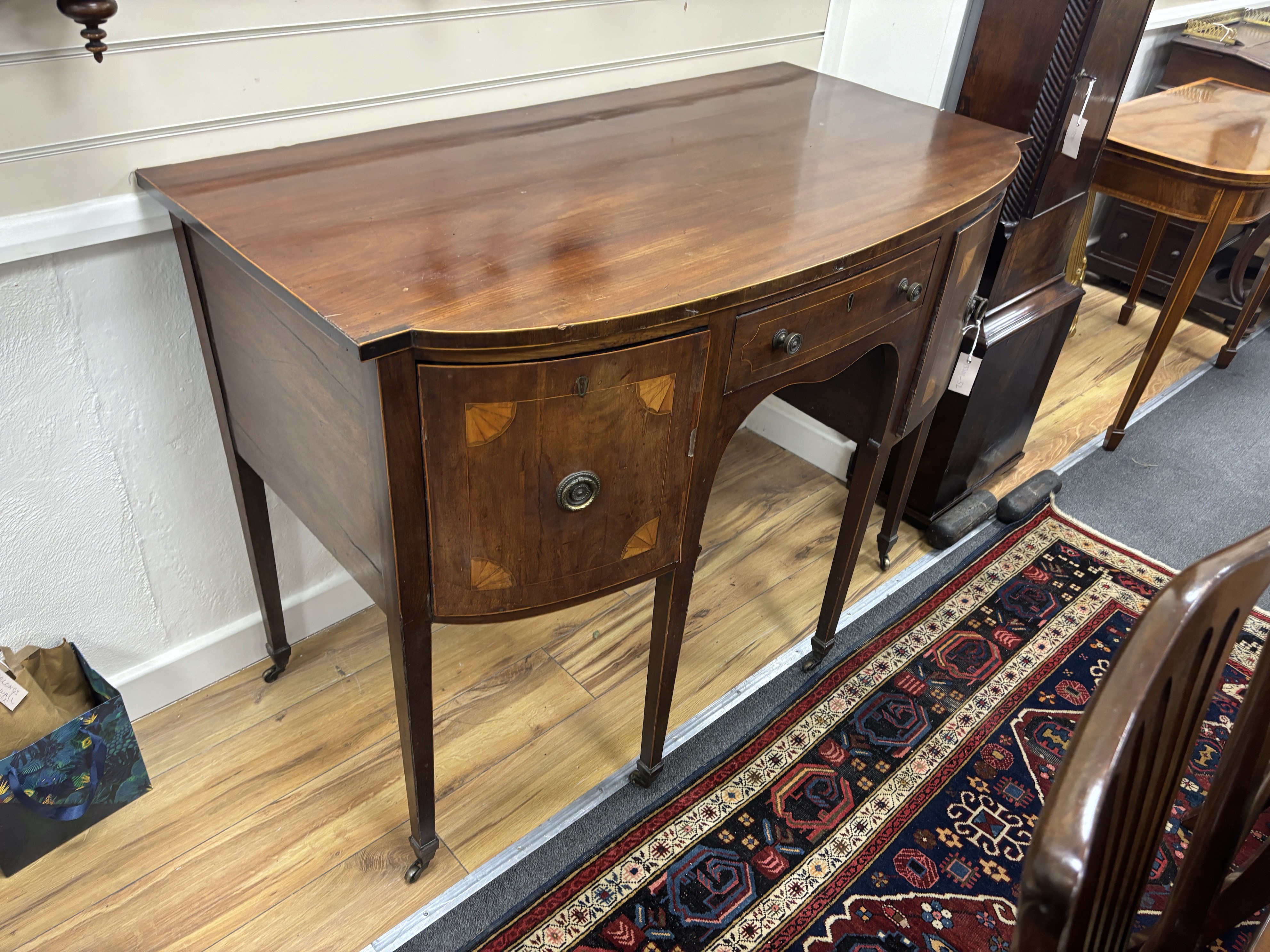 A George III style inlaid mahogany bow front sideboard, width 122cm, depth 65cm, height 91cm